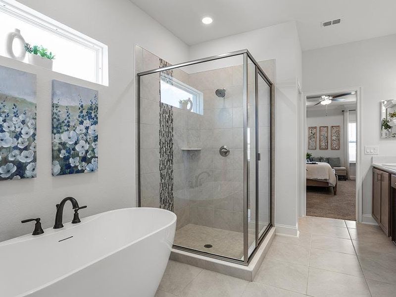 Your suite is complete with a spa-like en-suite bath - Waylyn model home in St. Cloud, FL