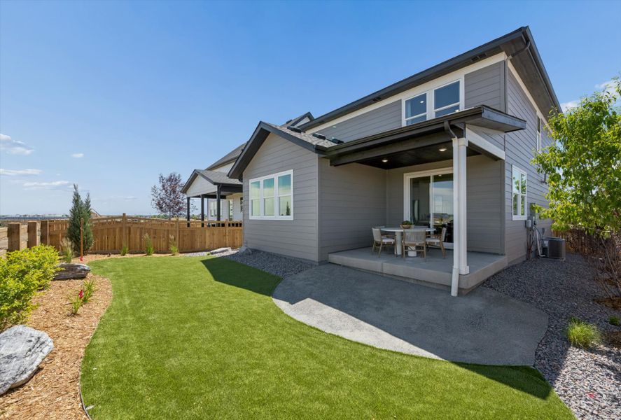A house with a lawn and a fence. A house with a lawn and a fence.