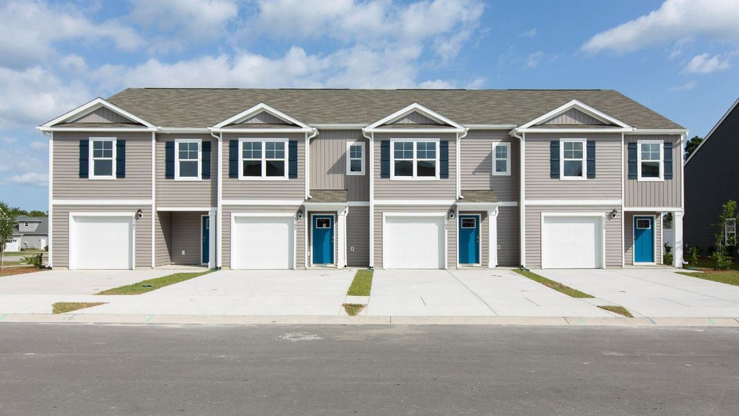 Front exterior of a home in the Townes at Seabrooke community, located in Leland, NC (Image 4).