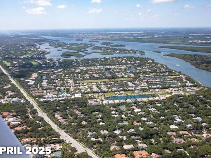 Aerial view of the The Strand community in Vero Beach, FL, showing layout and nearby surroundings (Image 7).