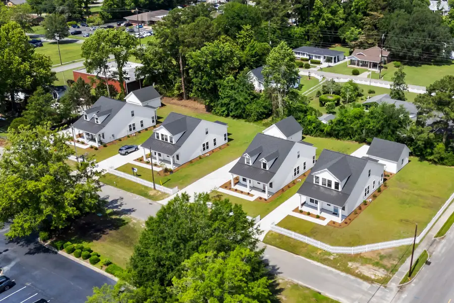 Aerial view of the Downtown Loris Homes community in Loris, SC, showing layout and nearby surroundings (Image 1). Aerial view of the Downtown Loris Homes community in Loris, SC, showing layout and nearby surroundings (Image 1).