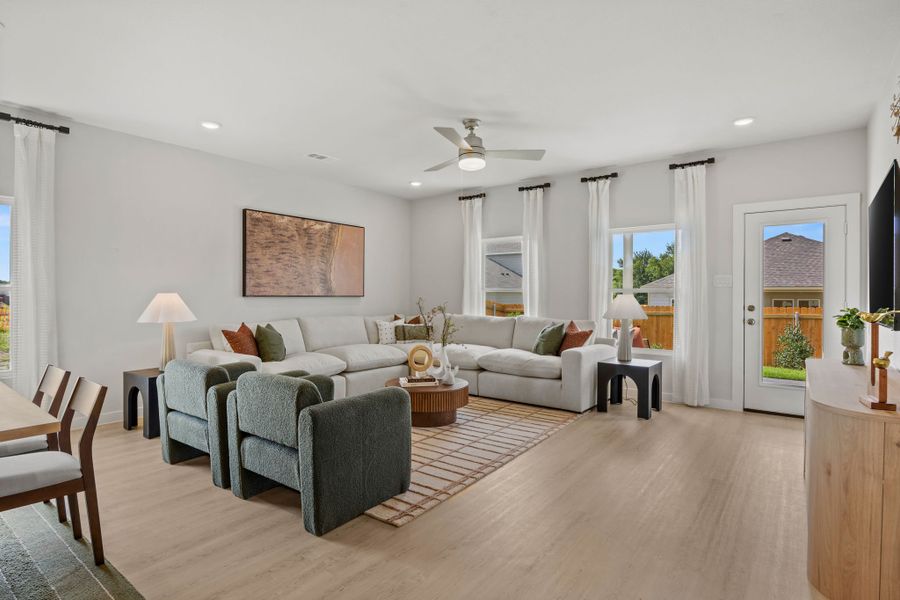 A living room with a wood floor. A living room with a wood floor.