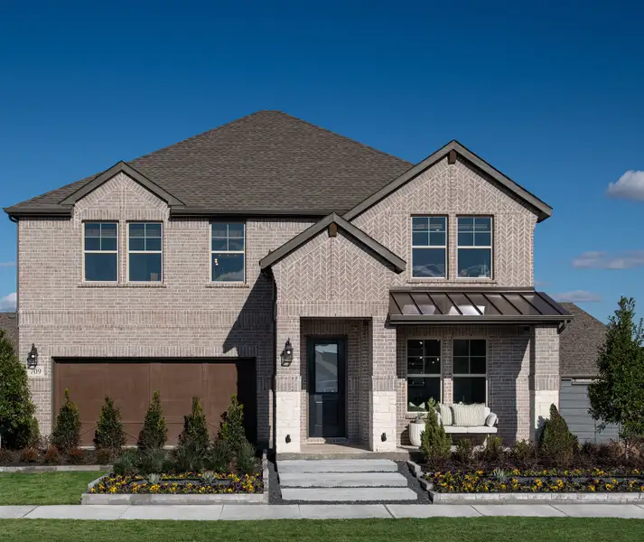 Front exterior of a home in the Union Park 50s community, located in Little Elm, TX (Image 15).