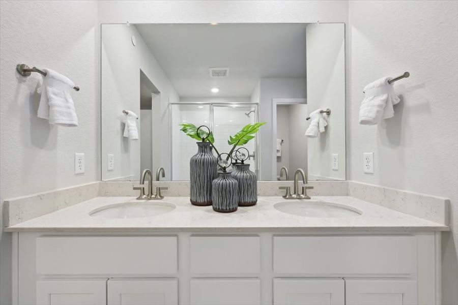 A bathroom with a large mirror.