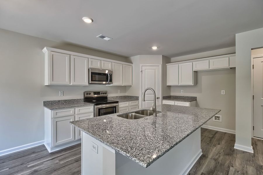 Furnished interior in a model home at South Welcome in Greenville (Image 6).