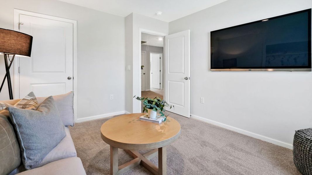 Furnished interior in a model home at Bella Point in Bolivia (Image 23).
