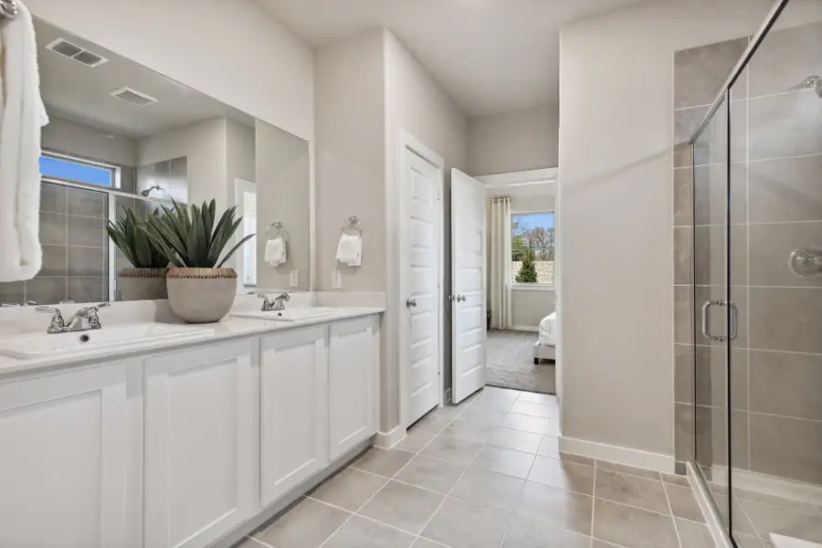 Primary Bathroom in an Oak Model Home by Trophy Signature Homes