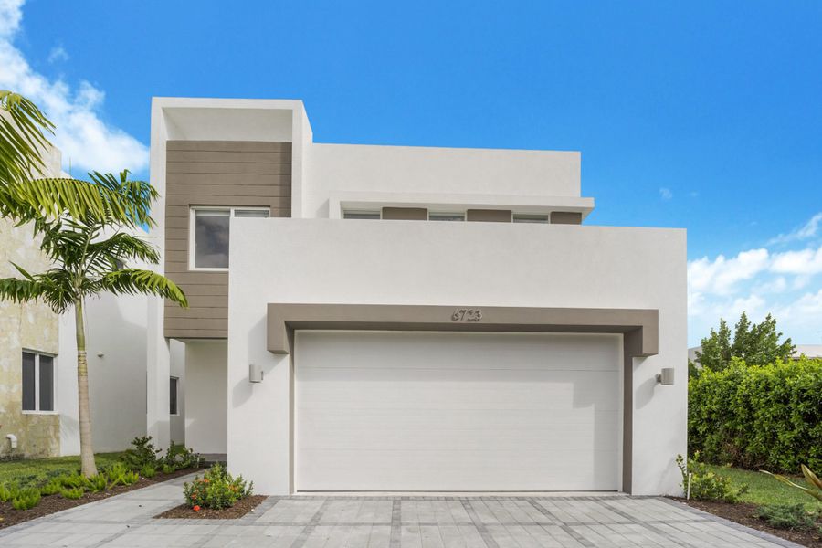 Front exterior of a home in the Vesta at Neovita Doral community, located in Doral, FL (Image 1).