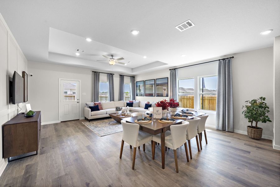 A large dining room with a large table and chairs.