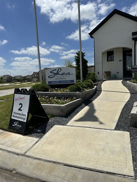 A modern sales center with landscaped walkways in Wood Leaf Reserve 40' by Shea Homes (Tomball, TX). A modern sales center with landscaped walkways in Wood Leaf Reserve 40' by Shea Homes (Tomball, TX).