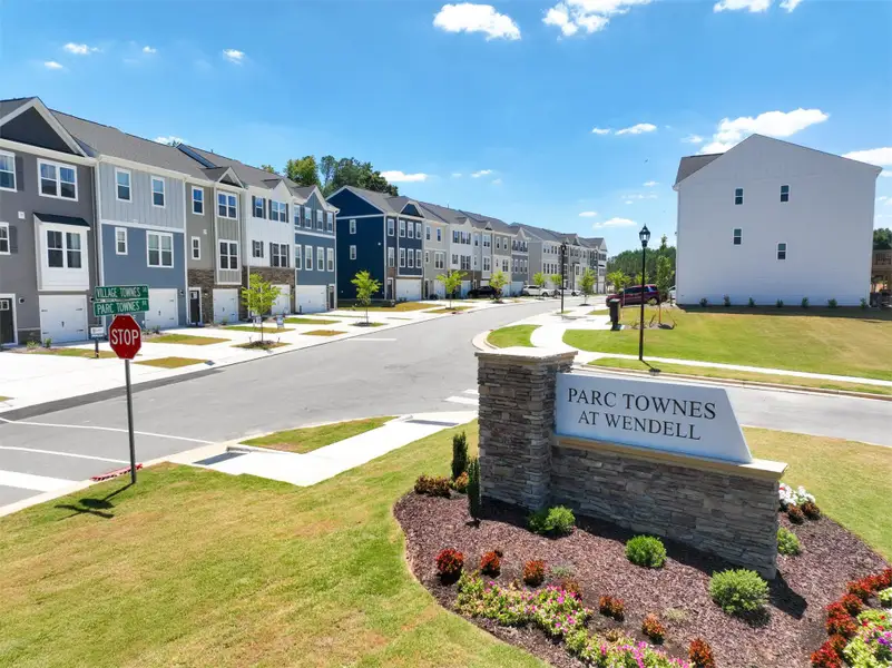 Entrance to the The Parc Townes at Wendell community in Wendell, NC, featuring signage and landscaping (Image 1).