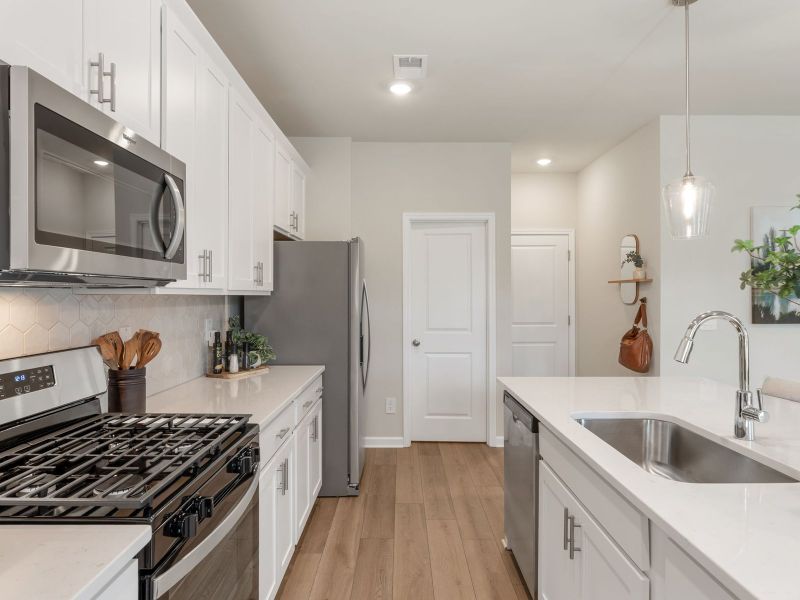 Furnished interior in a model home at Northwoods at Mirror Lake in Villa Rica (Image 7).
