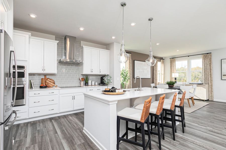 Chef-inspired kitchen with spacious island and storage that keeps life organized Chef-inspired kitchen with spacious island and storage that keeps life organized