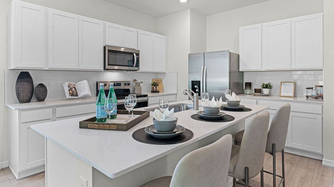 Furnished interior in a model home at Fish Lake Cove in Kissimmee (Image 6).