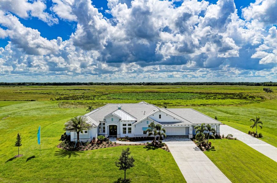 Front exterior of a home in the Hampton Lakes community, located in Sarasota, FL (Image 52).