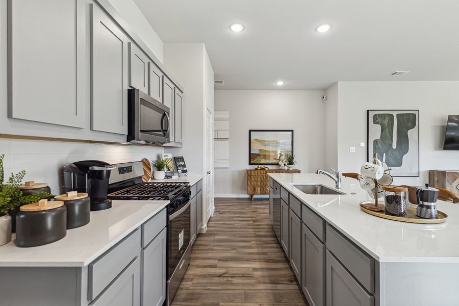 REPRESENTATIVE PHOTO – Kitchen in a Diamond model home by Trophy Signature Homes