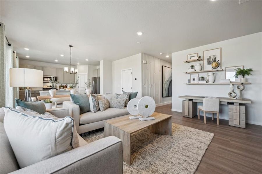 A living room with a wood floor.