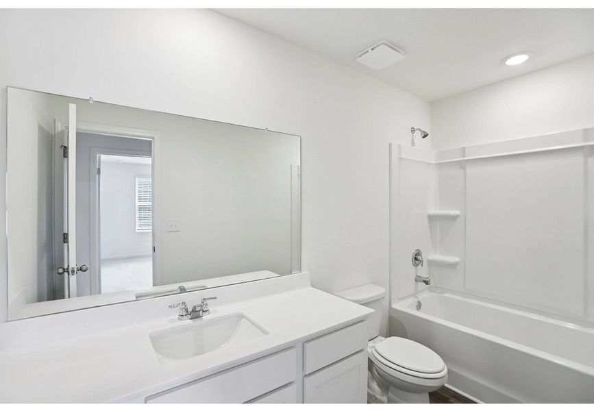 Furnished interior in a model home at Ashland in Angleton (Image 7).