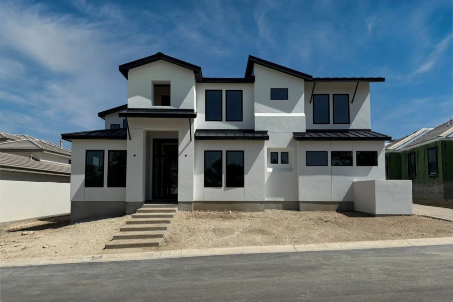 Front exterior of a home in the The Bluff At The Dominion community, located in Shavano Park, TX (Image 4).