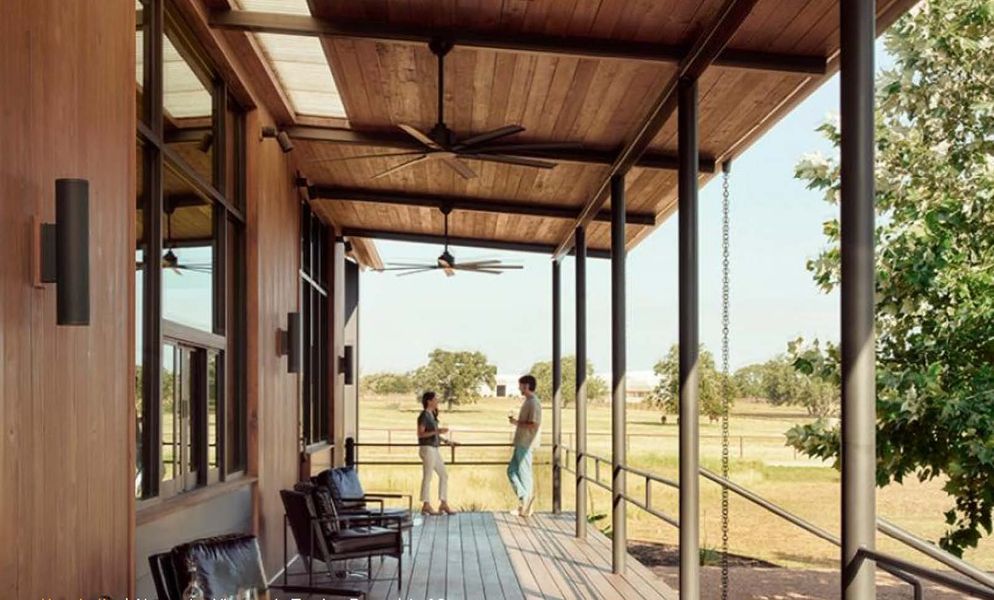 A couple of people walking on a wooden porch. A couple of people walking on a wooden porch.