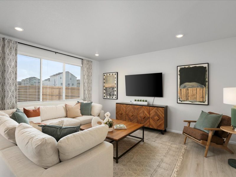 Furnished interior in a model home at Frontier Estates - The Trails Collection in Firestone (Image 6).