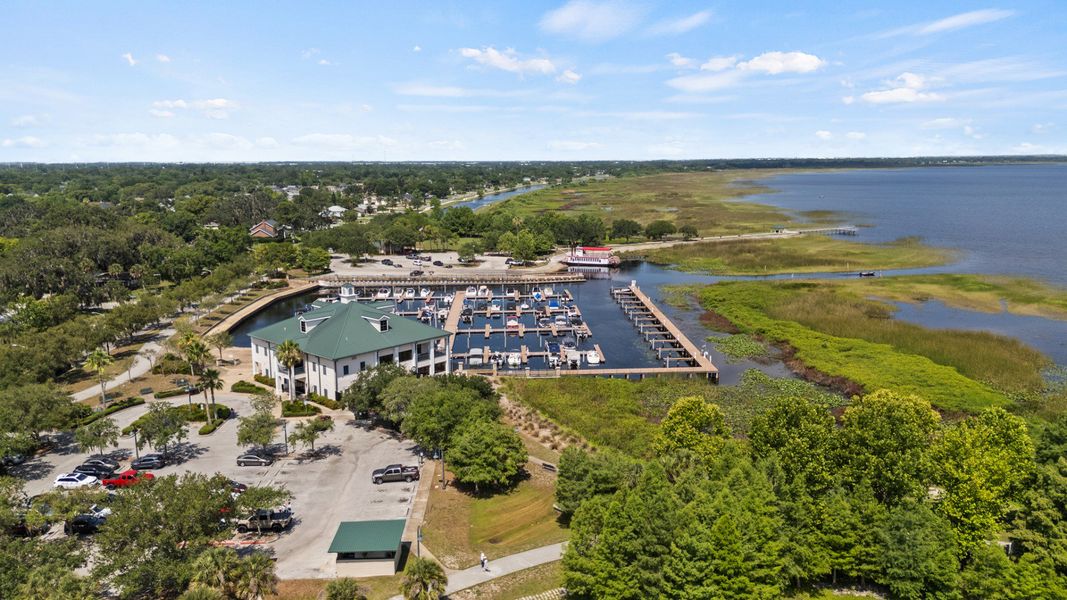 Aerial view of St. Cloud Marina with boat docks and scenic Lake Tohopekaliga shoreline near Cyrene at Harmony. Aerial view of St. Cloud Marina with boat docks and scenic Lake Tohopekaliga shoreline near Cyrene at Harmony.