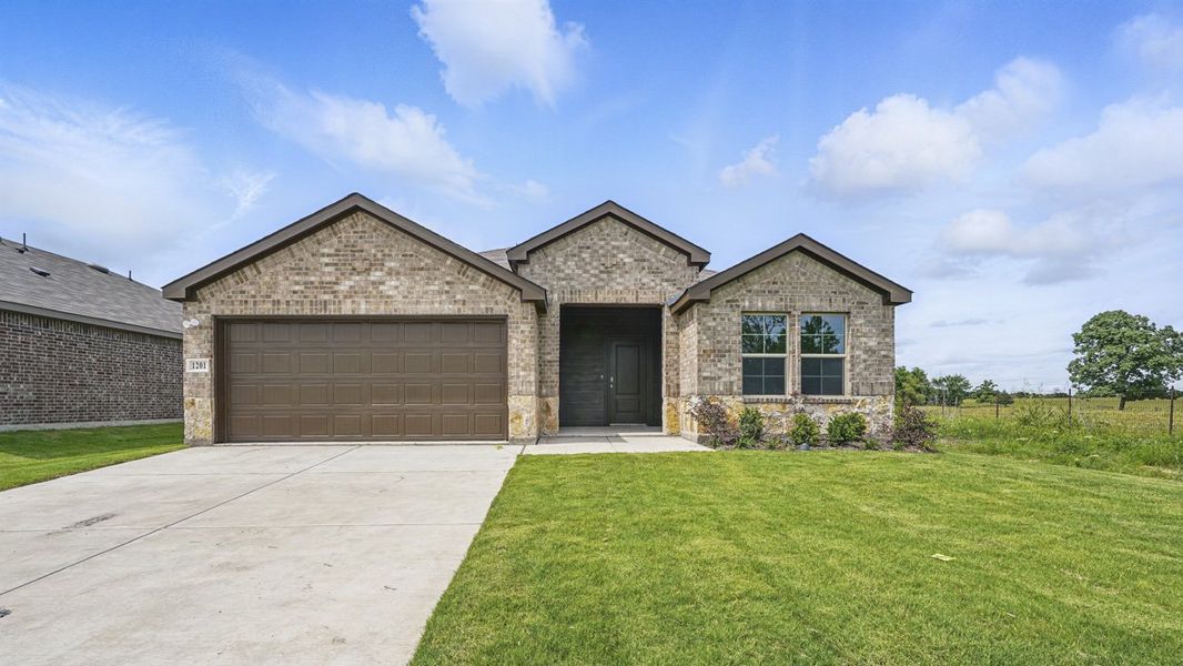 Front exterior of a home in the Leonard Crossing community, located in Leonard, TX (Image 2).