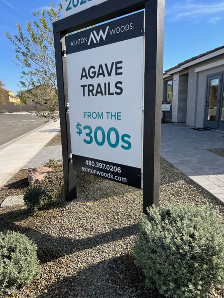 Charming new homes in Agave Trails by Ashton Woods, showcasing modern designs and landscaping in Allure Vista Estate Series (Buckeye, AZ).