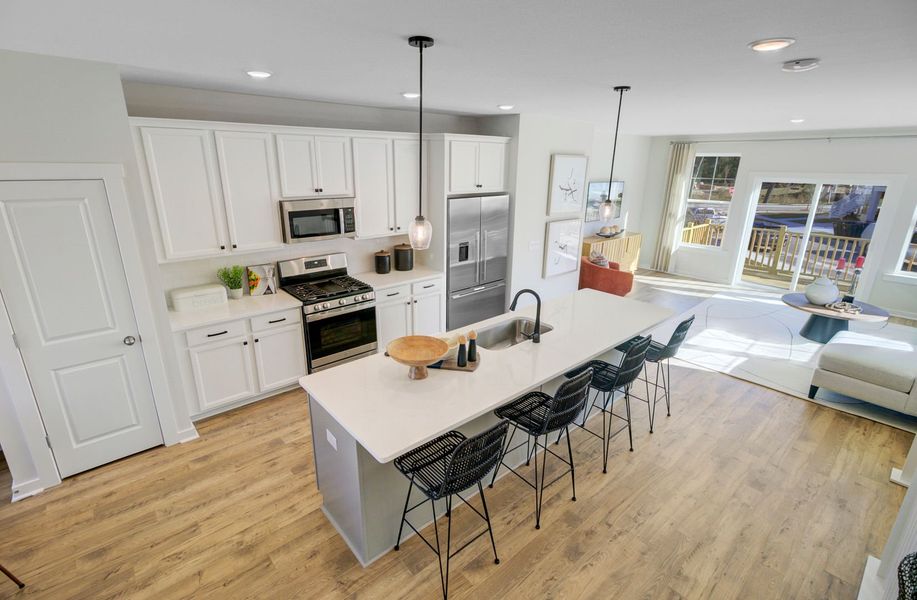 Modern kitchen with stylish finishes and ample workspace Modern kitchen with stylish finishes and ample workspace