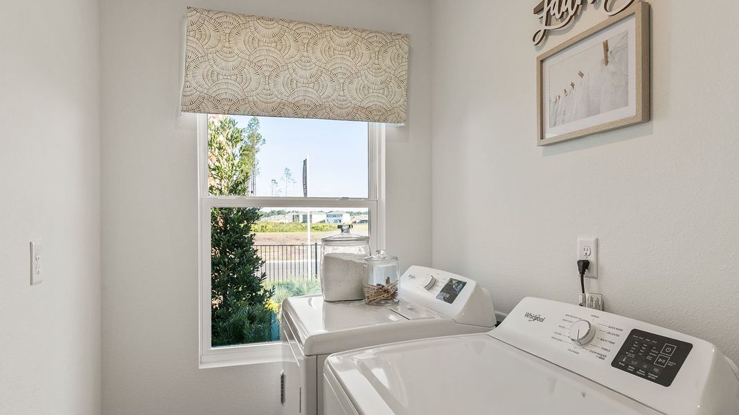Furnished interior in a model home at Copes Landing in Jacksonville (Image 60).