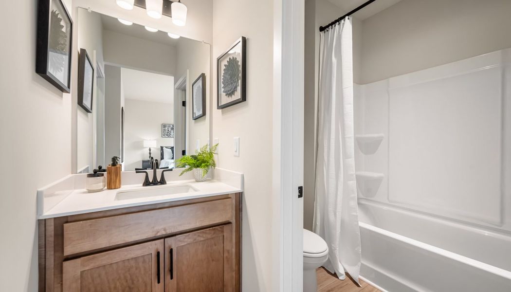 Furnished interior in a model home at Pinecrest Ridge in Dacula (Image 39).