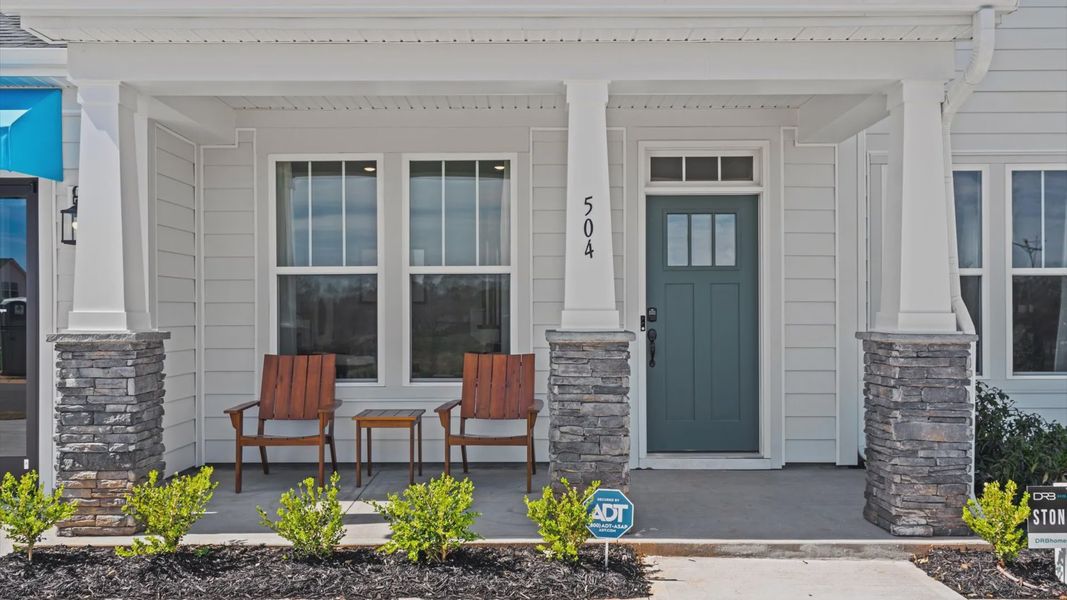 Adorable front porch with stone columns at Pinebrook by DRB Homes in Woodruff, SC Adorable front porch with stone columns at Pinebrook by DRB Homes in Woodruff, SC