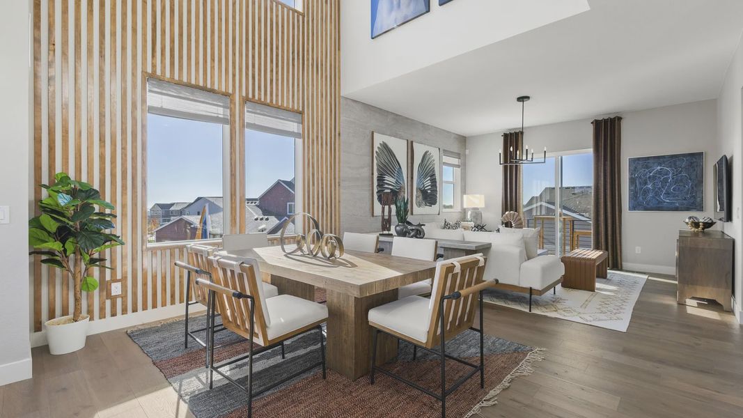 Luxurious wooden slat walls complement expansive windows and chic decor in Dillon Pointe's elegant living space. Luxurious wooden slat walls complement expansive windows and chic decor in Dillon Pointe's elegant living space.