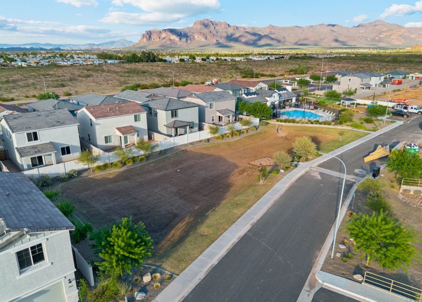 A neighborhood with a road and houses. A neighborhood with a road and houses.
