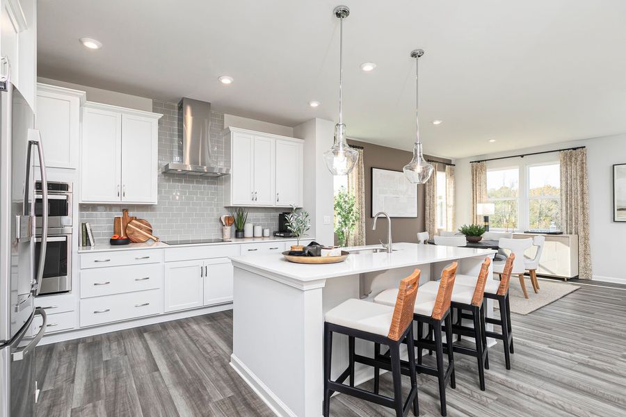 Chef-inspired kitchen with spacious island and storage that keeps life organized Chef-inspired kitchen with spacious island and storage that keeps life organized