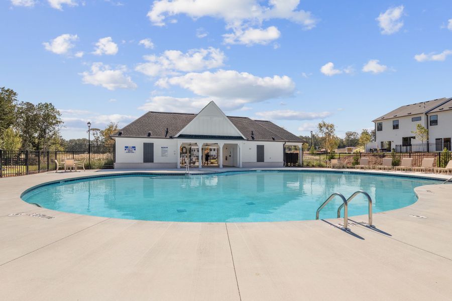 A swimming pool in front of a house. A swimming pool in front of a house.
