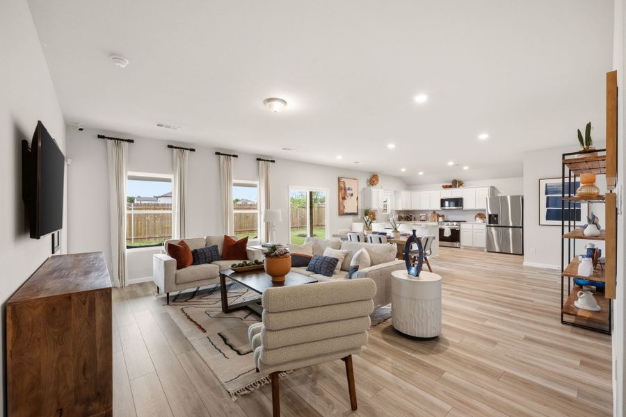 A living room with a wood floor. A living room with a wood floor.