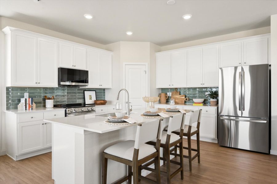 A kitchen with white cabinets. A kitchen with white cabinets.