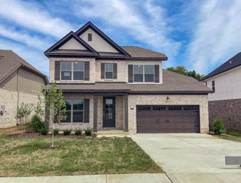 Front exterior of a home in the The Paddock community, located in Gallatin, TN (Image 2).