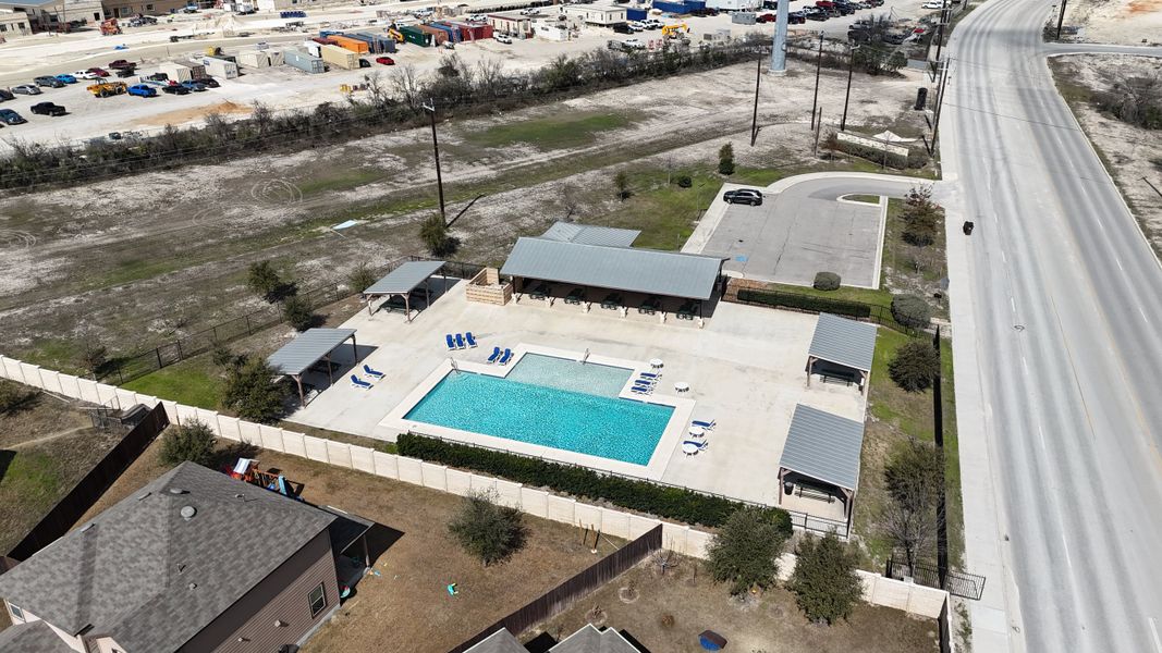 Aerial view of a community pool and amenities in Hunter's Ranch by Hakes Brothers, located in San Antonio, TX.