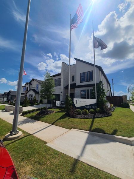Modern model home with sleek design and flags, situated in the Madero community by Trophy Signature Homes (Haslet, TX). Modern model home with sleek design and flags, situated in the Madero community by Trophy Signature Homes (Haslet, TX).