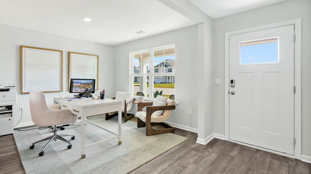 Furnished interior in a model home at Bella Point in Bolivia (Image 19).