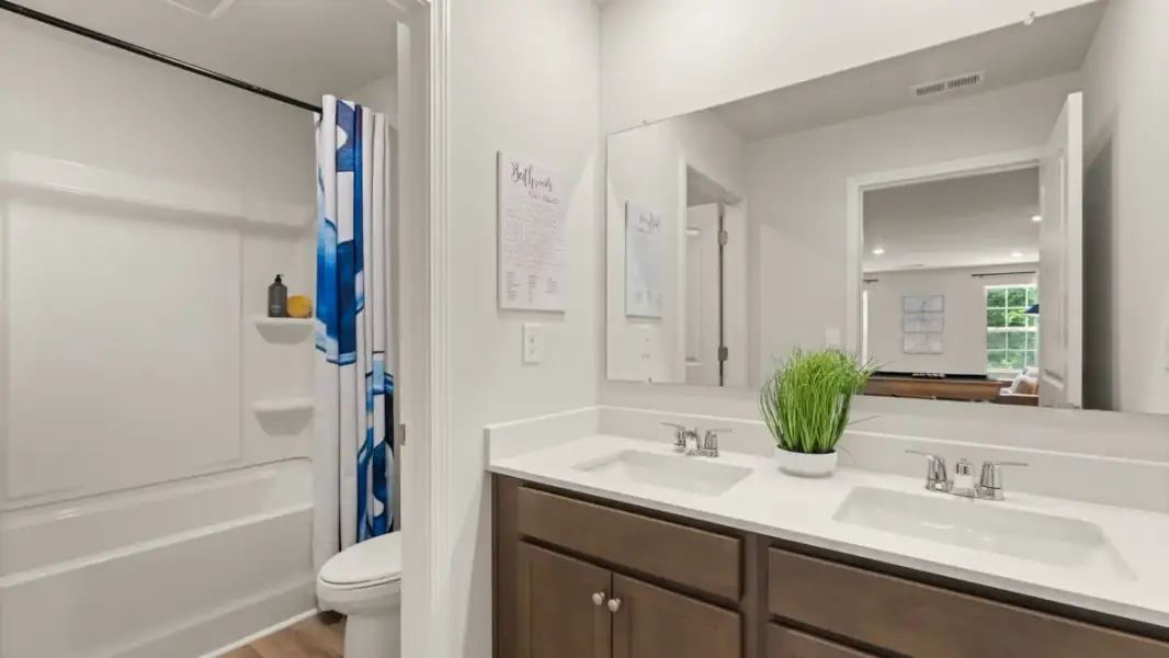 Furnished interior in a model home at Enclave at Stonewall Tell in South Fulton (Image 24).