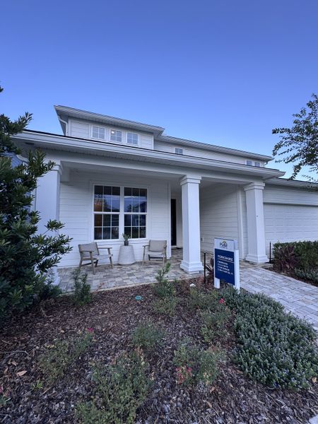 A charming white home with a cozy porch and manicured garden in Kindlewood Forest by D.R. Horton (Middleburg, FL). A charming white home with a cozy porch and manicured garden in Kindlewood Forest by D.R. Horton (Middleburg, FL).