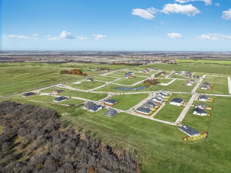 Aerial view of the The Ranch at Uptown Celina community in Celina, TX, showing layout and nearby surroundings (Image 9). Aerial view of the The Ranch at Uptown Celina community in Celina, TX, showing layout and nearby surroundings (Image 9).