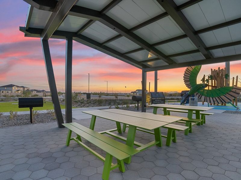 A picnic table under a covered area. A picnic table under a covered area.