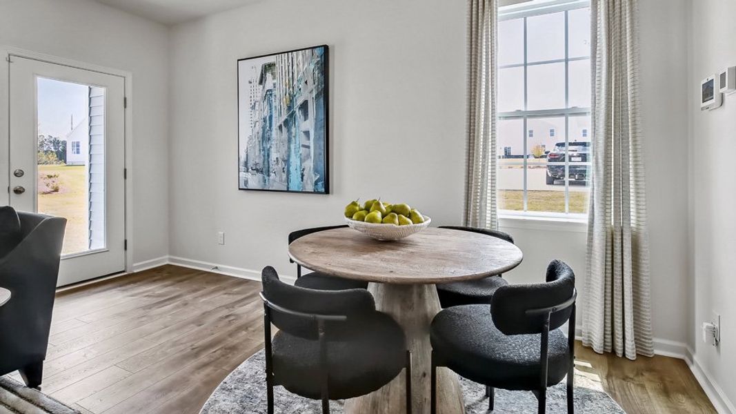 Furnished interior in a model home at The Townes at Prestleigh in Wake Forest (Image 8).