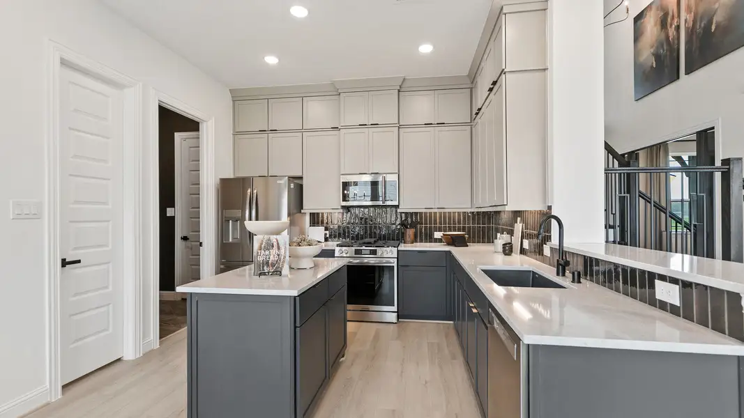 Experience luxury with elegant cabinetry and exquisite marble countertops in Park at Eldridge, Houston.