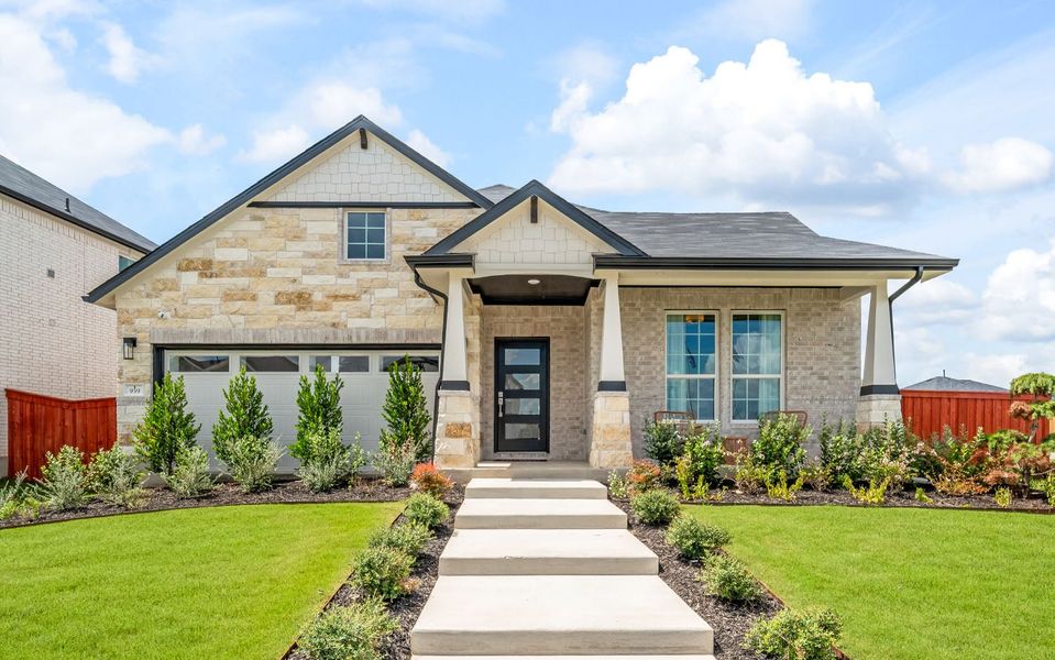 Front exterior of a home in the Sunfield community, located in Buda, TX (Image 14).