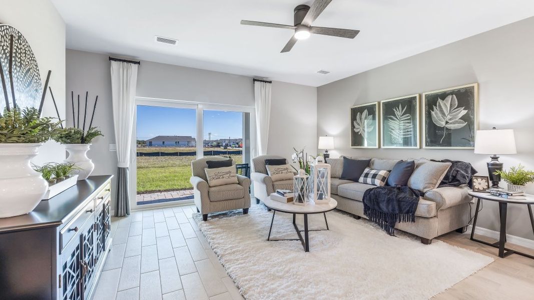 Furnished interior in a model home at Asher Park in Lehigh Acres (Image 14).